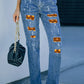 Distressed Pumpkin Pattern Jeans with Pockets